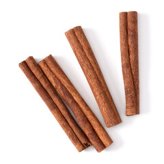 Cinnamon sticks isolated on white background closeup. Canella spice. Aromatic condiment background. Flat lay, top view.