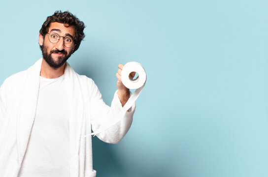 young crazy bearded man wearing bathrobe and toilet paper