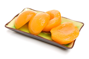 Canned peach in syrup on a white background 