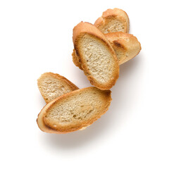 Toasted baguette slices isolated on white background close up.  Toast, crouton.   Top view.