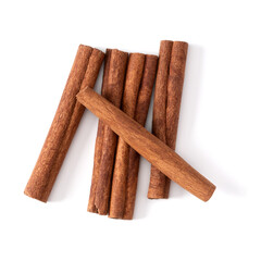 Cinnamon sticks isolated on white background closeup. Canella spice. Aromatic condiment background. Flat lay, top view.