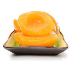 Canned peach in syrup on a white background 