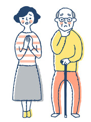 困っている表情のシニア夫婦