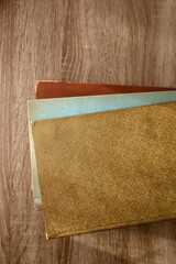 Stack of beautiful vintage books on wooden background. Top view. 