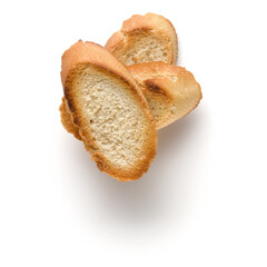 Toasted baguette slices isolated on white background close up.  Toast, crouton.   Top view.