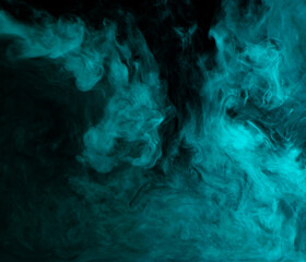 Abstract background of chaotically mixing clouds of turquoise smoke on a background of darkness