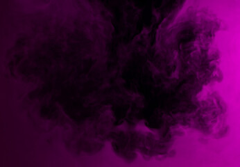 Obraz na płótnie Canvas Abstract background of chaotically mixing puffs of purple smoke on a dark background
