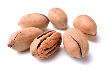 Peeled pecan nuts closeup, isolated on white background