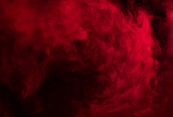 Abstract background of chaotically mixing puffs of red smoke on a dark background