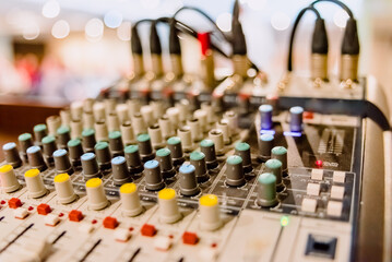 Audio mixing console in a conference room.
