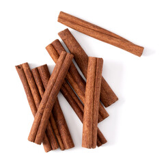 Cinnamon sticks isolated on white background closeup. Canella spice. Aromatic condiment background. Flat lay, top view.