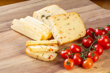 Soft cheese with olives and cheese with chili peppers with tomatoes and rosemary – wood