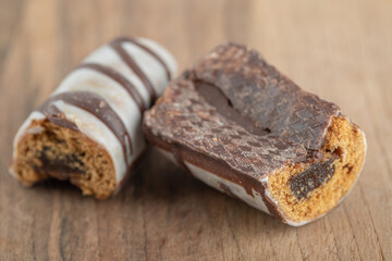 Delicious chocolate bar on a wooden table