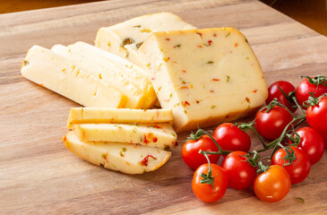 Soft cheese with olives and cheese with chili peppers with tomatoes and rosemary &ndash; wood