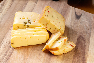 Soft cheese with olives and cheese with chili peppers with tomatoes and rosemary – wood