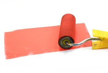 Obraz premium Paint roller leaving stroke of red color over a white background. usable for text and messages.