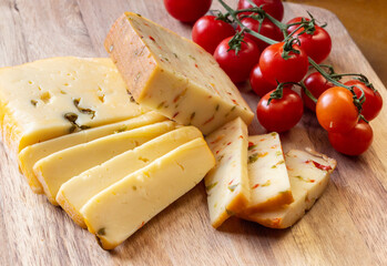 Soft cheese with olives and cheese with chili peppers with tomatoes and rosemary – wood