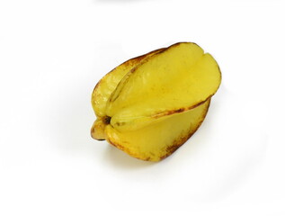 Star shaped slices of carambola fruit isolated on white background. Carambola fruit with slice of star fruit  isolated on a white background.