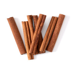 Cinnamon sticks isolated on white background closeup. Canella spice. Aromatic condiment background. Flat lay, top view.
