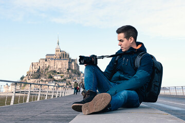 Sitting man taking photos