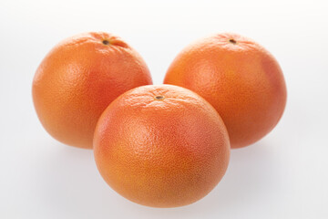 Juicy grapefruits isolated on white