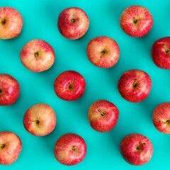 Fruit pattern of red apple on blue background. Flat lay, top view. Pop art design, creative summer concept. Food background.