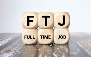 Cubes or dice with acronym FTJ for Full Time Job