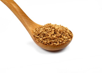 Buckwheat flakes in a wooden spoon isolated on white background. Healthy buckwheat flakes. Healthy food.