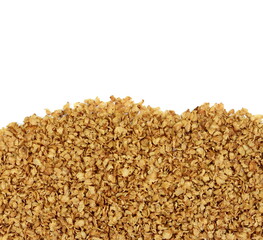 Buckwheat flakes isolated on white background. Healthy buckwheat flakes. Healthy food.
