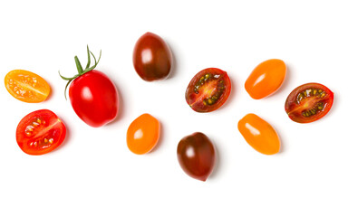 various colorful tomatoes isolated over white background. Top view, flat lay. Creative layout..
