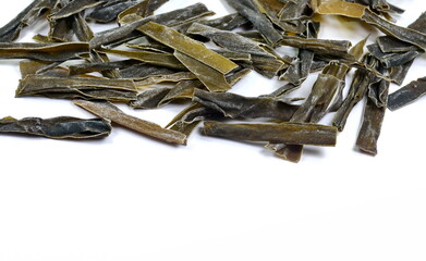  Dried kombu seaweed Japanese dry kelp isolated on white background © Sanja