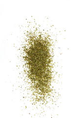Dry marjoram spice (Origanum majorana). Heap of ground marjoram leaves isolated on white.