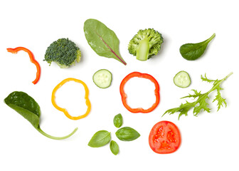 Creative layout made of tomato slice, cucumber, basil leaves. Flat lay, top view. Food concept. Vegetables isolated on white background. Food ingredients pattern.