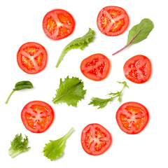 Creative layout made of tomato slices and lettuce salad leaves. Flat lay, top view. Food concept. Vegetables isolated on white background. Food ingredients pattern.