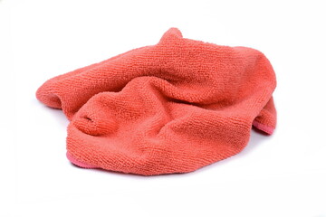 Red micro fiber towel isolated on white background. Clean, new red microfiber cloth isolated on white background