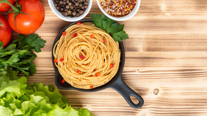 Delicious Italian pasta with seasonings and herbs. Copy the space. Top view.