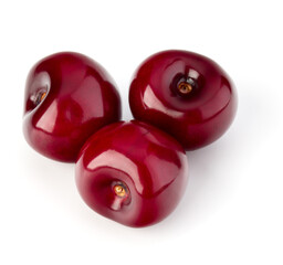 Sweet cherries pile isolated on white background