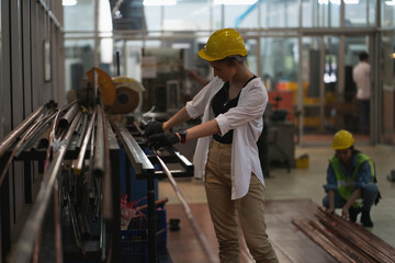 Worker factory women concept. Inspection technician, factory engineer, inspection of the machine condition in the factory. Inspection by technicians, industrial business, production machinery