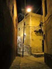 narrow street in the old town of Guanajuato, Mexico at night