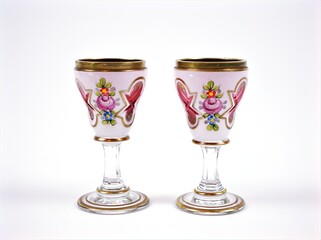 Old Chalices glass english style ,pink flower Twas the night water goblets isolated on white background	
