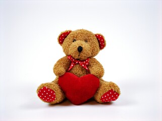 Teddy bear toy isolated on white background ,happy valentines ,teddy bear with red heart