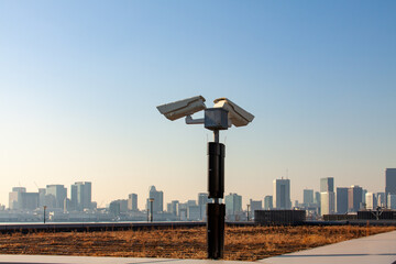 CCTV cameras and surveillance security system faces Tokyo skyline