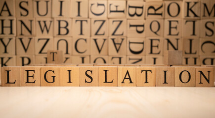 The word legislation from wooden cubes. Economy state government terms.