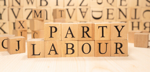 The word Labor Party is made of wooden cubes. Economy state government terms.