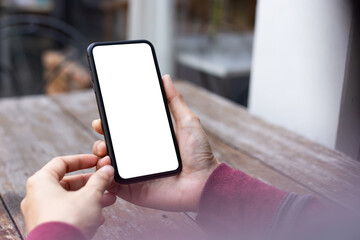 cell phone blank white screen mockup.woman hand holding texting using mobile on desk at office.background empty space for advertise.work people contact marketing business,technology