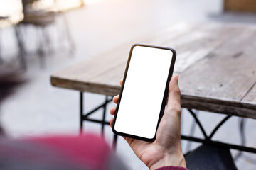 cell phone blank white screen mockup.woman hand holding texting using mobile on desk at office.background empty space for advertise.work people contact marketing business,technology