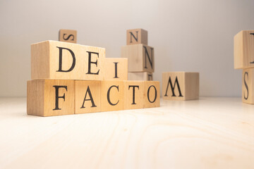 The Defacto Word is from wooden cubes. Terms of state government.