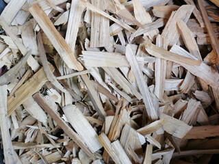 Firewood background - chopped firewood on a stack. Dry chopped firewood logs in a pile.