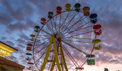 Ferris wheel in the evening in the park.