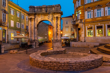 Sunrise view of Arch of the Sergii at Croatian town Pula